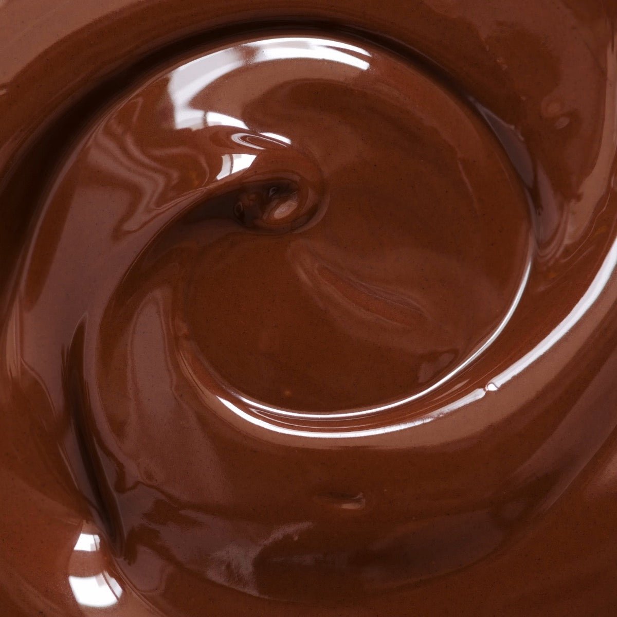 Close-up of glossy swirled melted chocolate