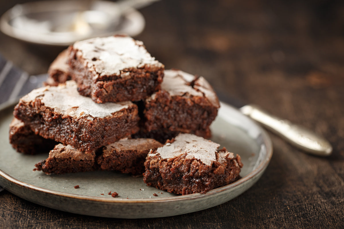 Stacked chocolate brownies on a plate