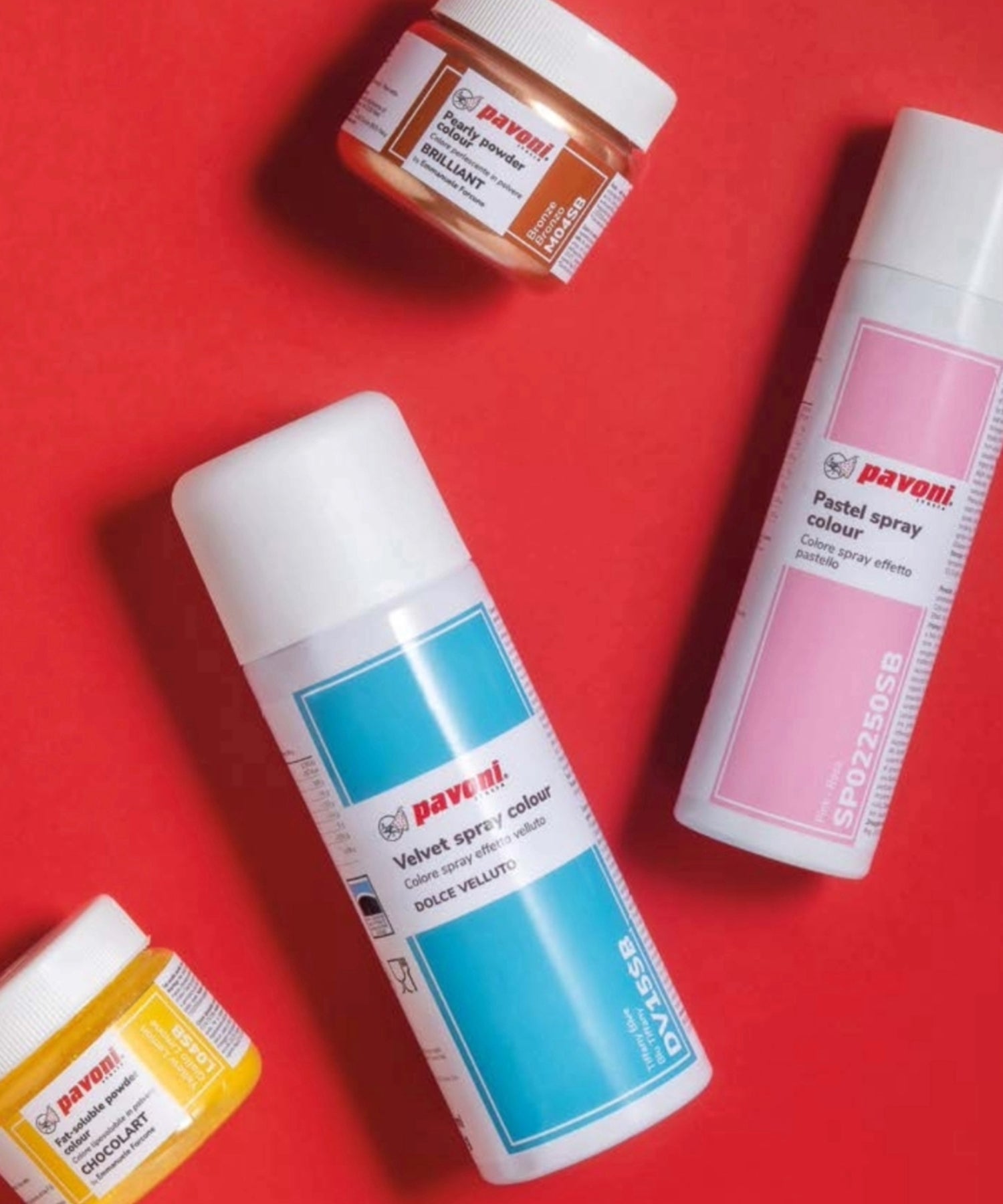 Pavoni Italia food coloring collection, including velvet spray colour, pastel spray, and powdered food colors for chocolate and pastry decoration